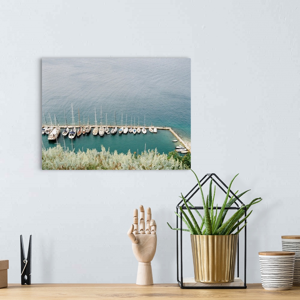 A bohemian room featuring Photograph of several sailing boats moored in a simple marina, Corfu, Greece.