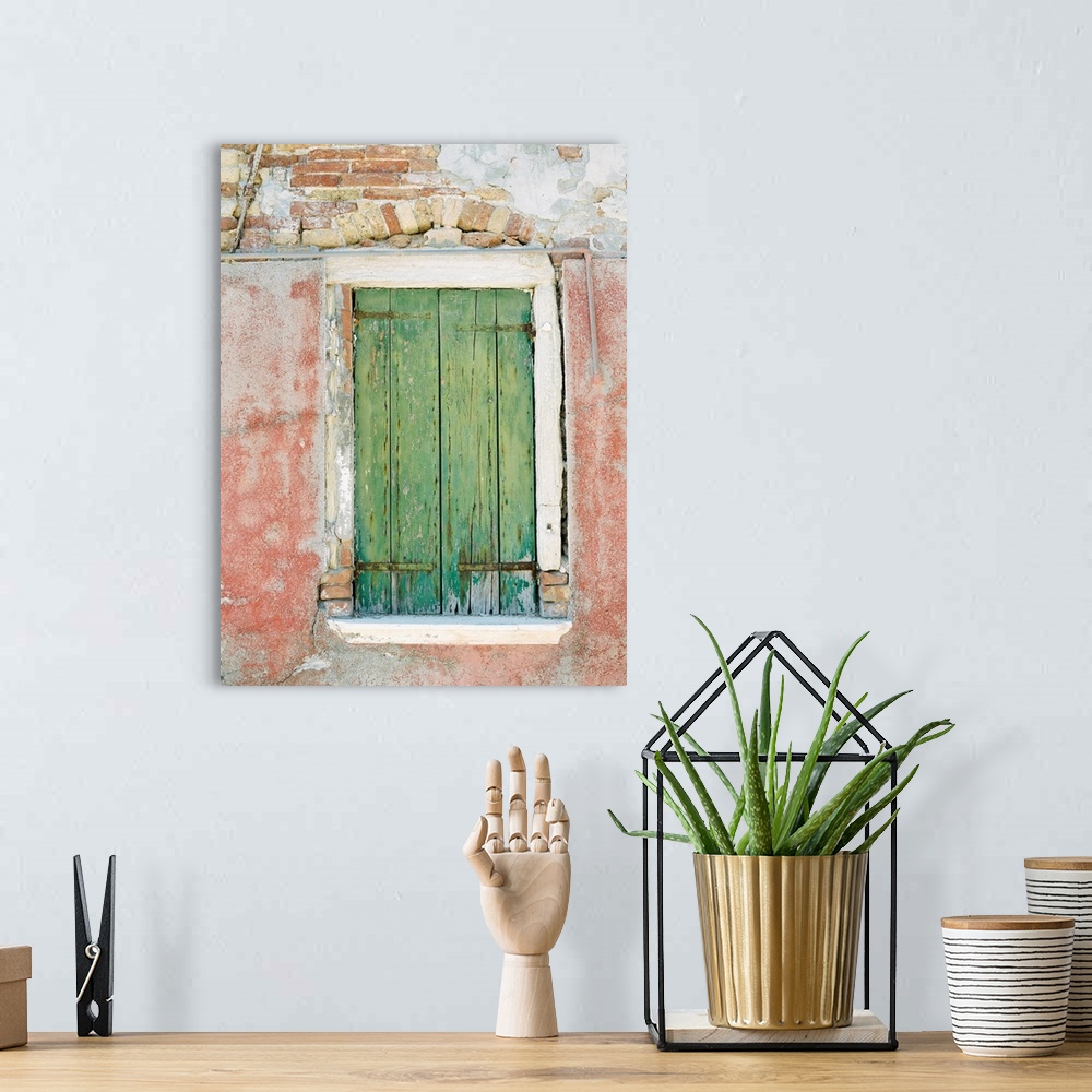 A bohemian room featuring Photograph of a small window with ancient green shutters, Burano, Italy.