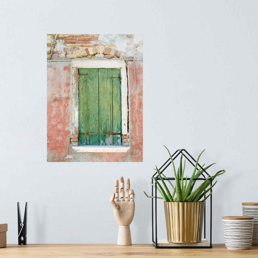 A bohemian room featuring Photograph of a small window with ancient green shutters, Burano, Italy.