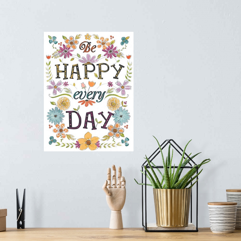 A bohemian room featuring Bright, happy typographical art with floral elements. "Be Happy Every Day."
