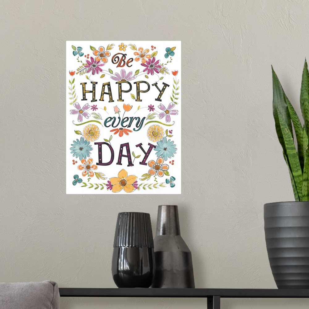 A modern room featuring Bright, happy typographical art with floral elements. "Be Happy Every Day."