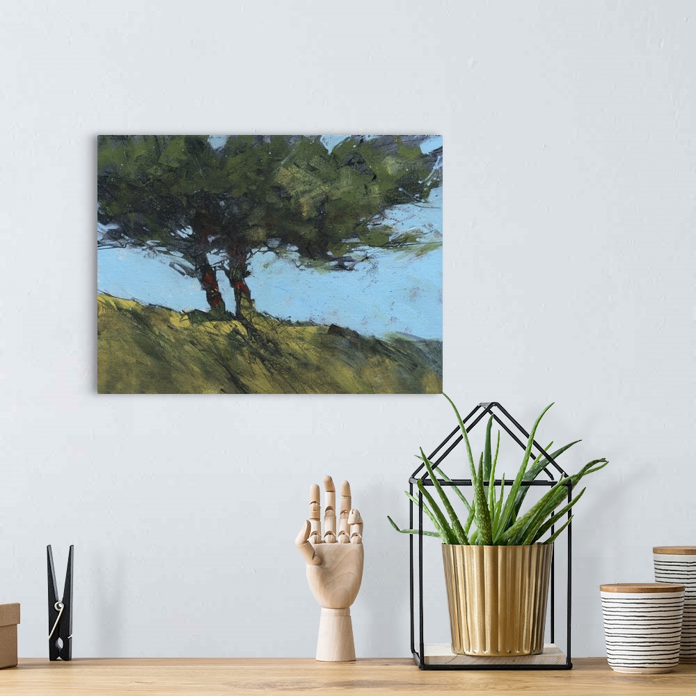 A bohemian room featuring Contemporary painting of twin trees next to each other on a hill.