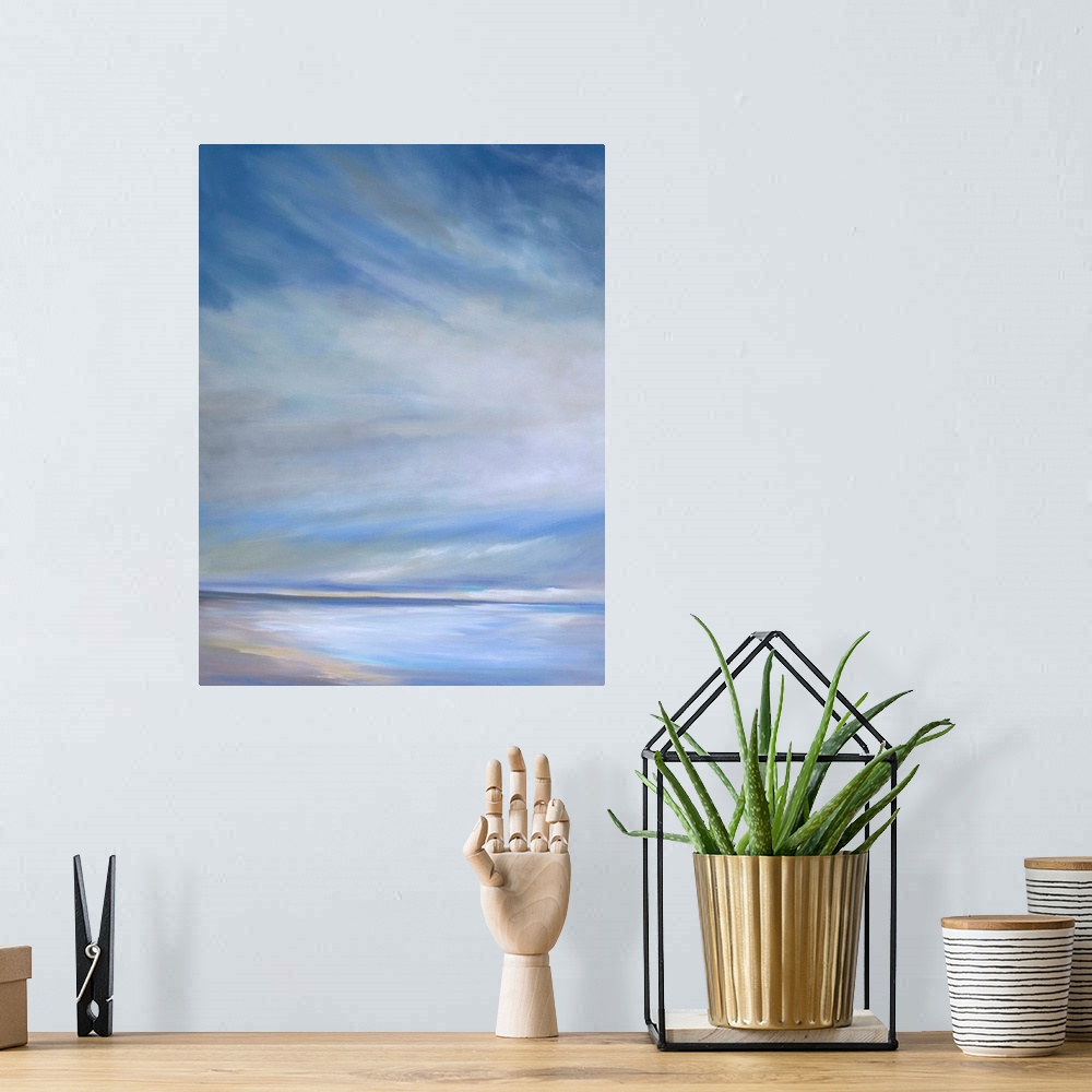 A bohemian room featuring Contemporary painting of a seascape with soft light streaming through the clouds.