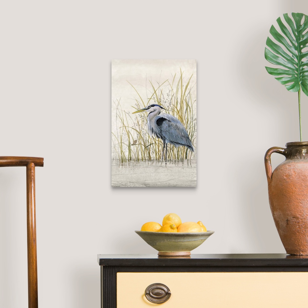 A traditional room featuring Contemporary artwork of a heron standing in shallow water among tall grass.