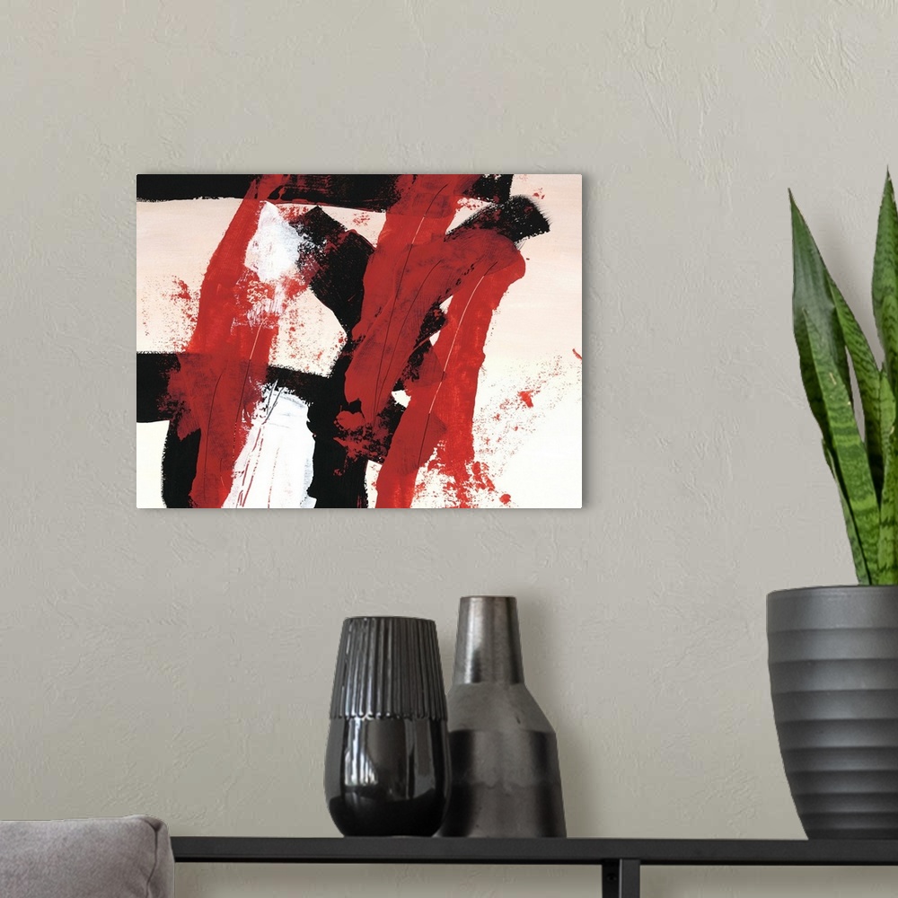 A modern room featuring Bold abstract painting in red, white, and black, with broad brushstrokes.
