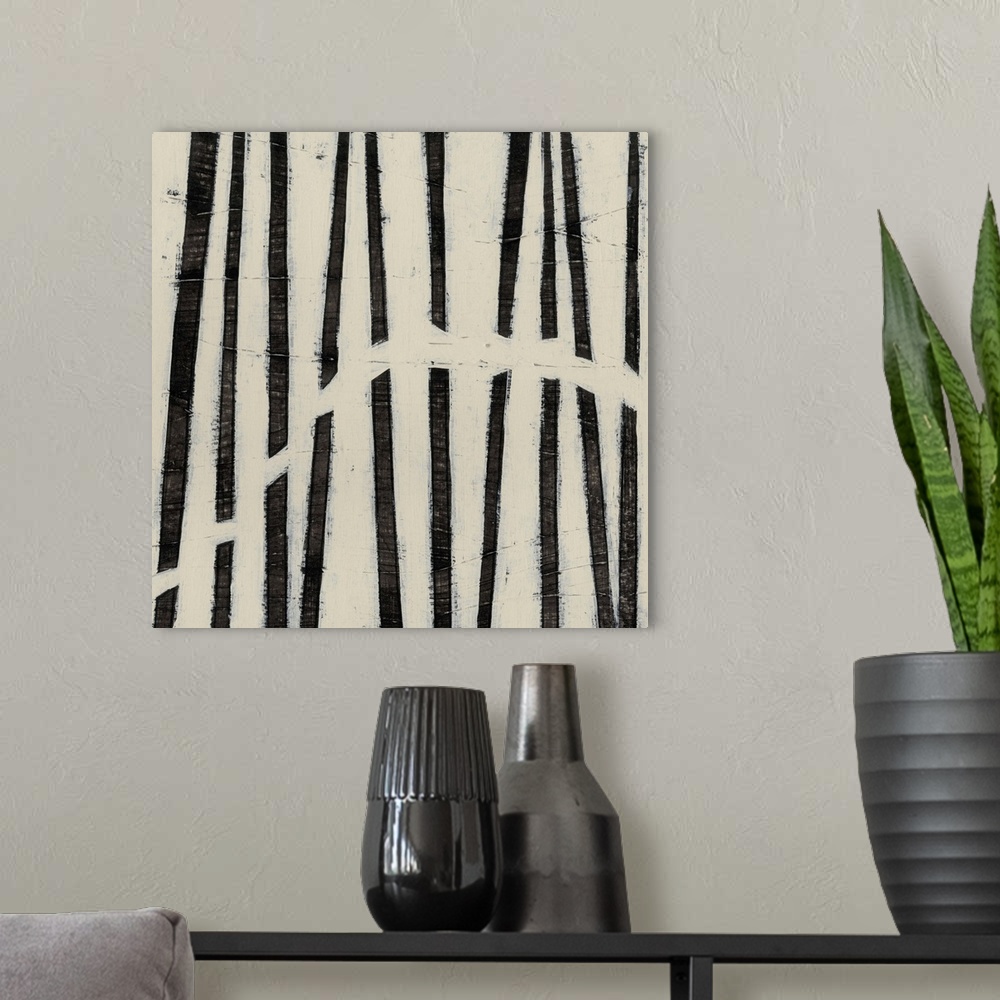 A modern room featuring Black and white abstract artwork made of parallel lines.
