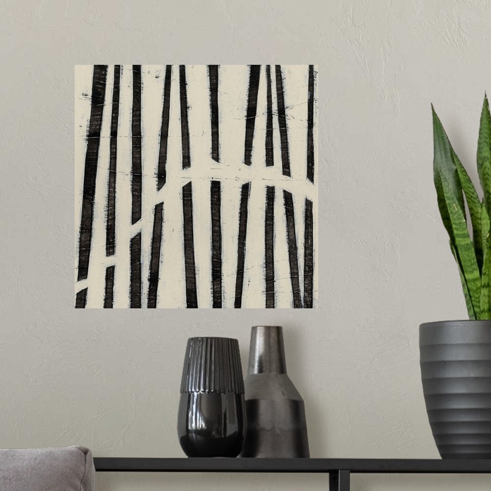 A modern room featuring Black and white abstract artwork made of parallel lines.