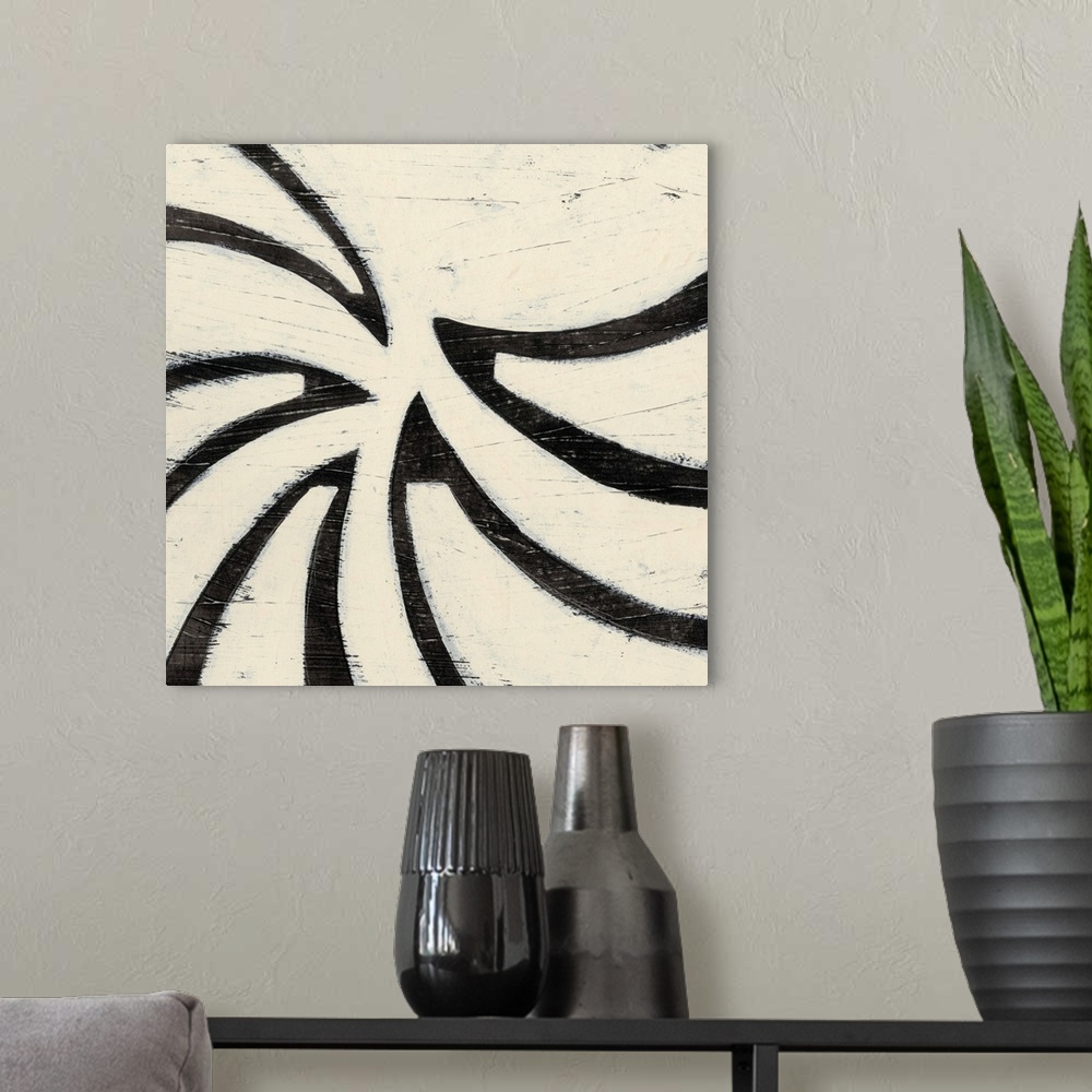 A modern room featuring Black and white abstract artwork made of curved shapes.