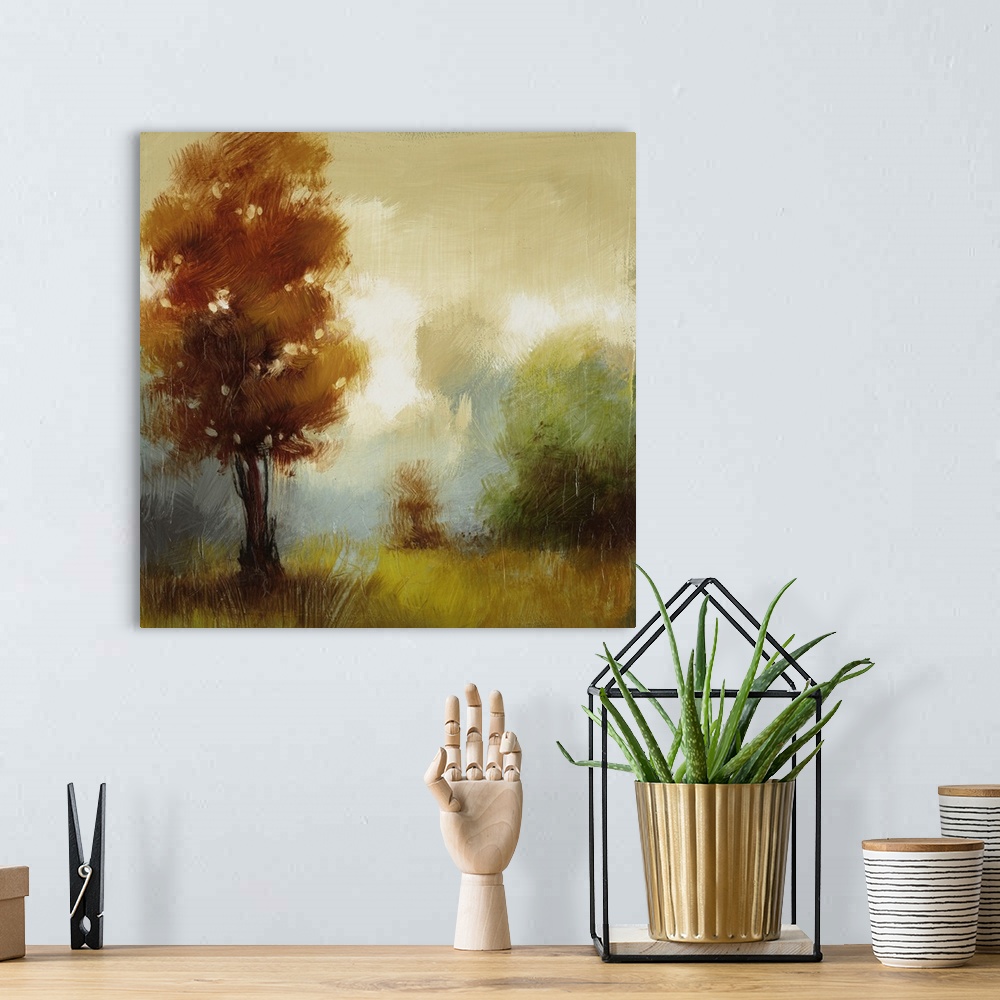 A bohemian room featuring Contemporary painting of several trees in fall colors in a foggy field.