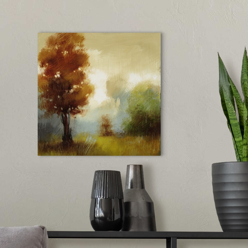 A modern room featuring Contemporary painting of several trees in fall colors in a foggy field.