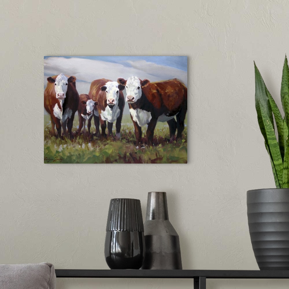 A modern room featuring Contemporary painting of a family of cows in a field.