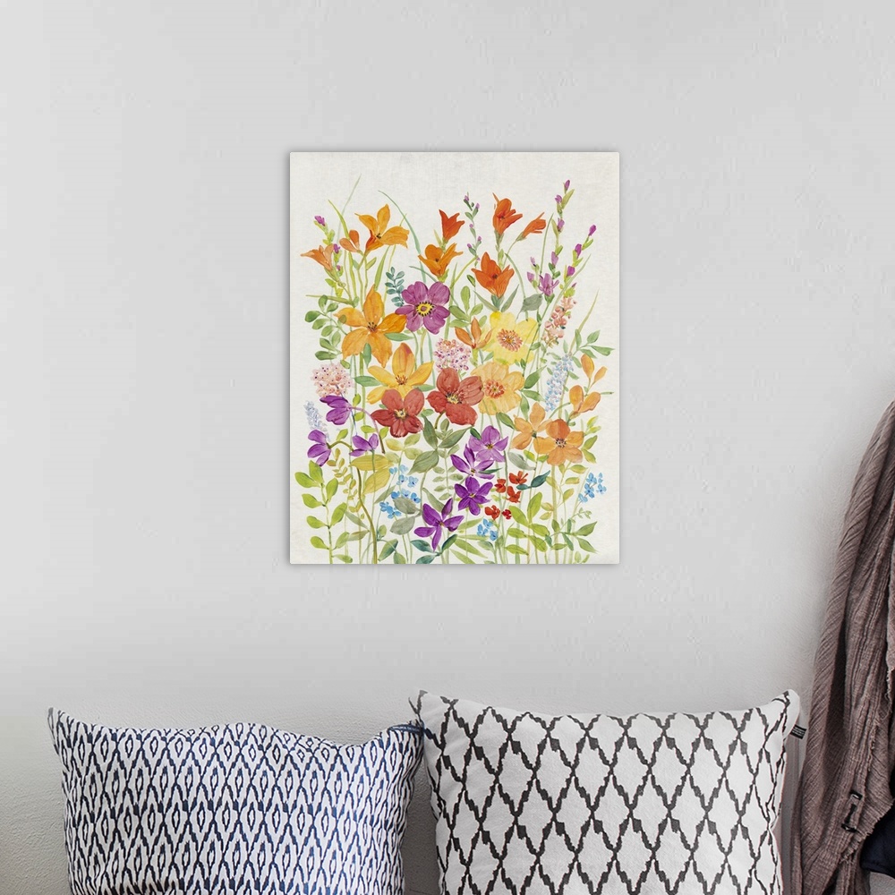 A bohemian room featuring A charming painting of  vibrant, warm colored wild flowers in a summer garden.