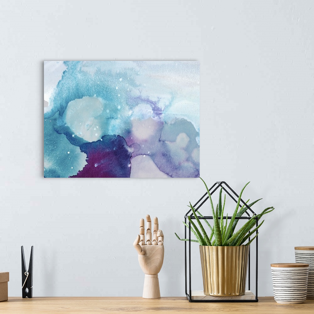 A bohemian room featuring Abstract watercolor art in cool blue and purple shades with white spots, resembling icy water.