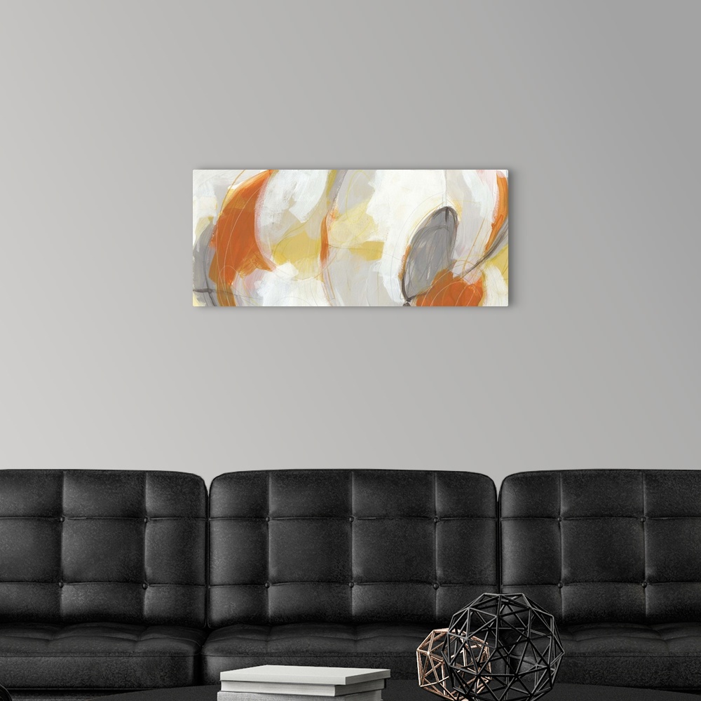 A modern room featuring Abstract artwork in large oval shapes in orange, yellow and white.