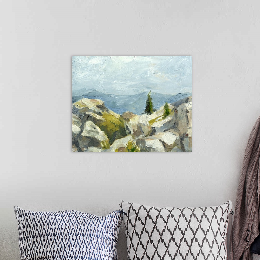 A bohemian room featuring Contemporary painting of boulders on hillside under a blue sky.