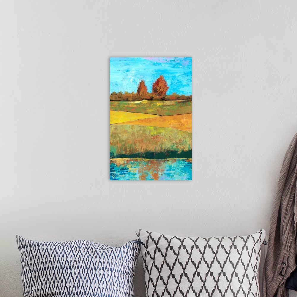 A bohemian room featuring Contemporary painting of a countryside landscape with green fields.