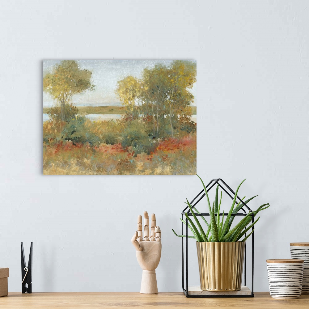 A bohemian room featuring Contemporary painting of an idyllic countryside scene with trees and a river.