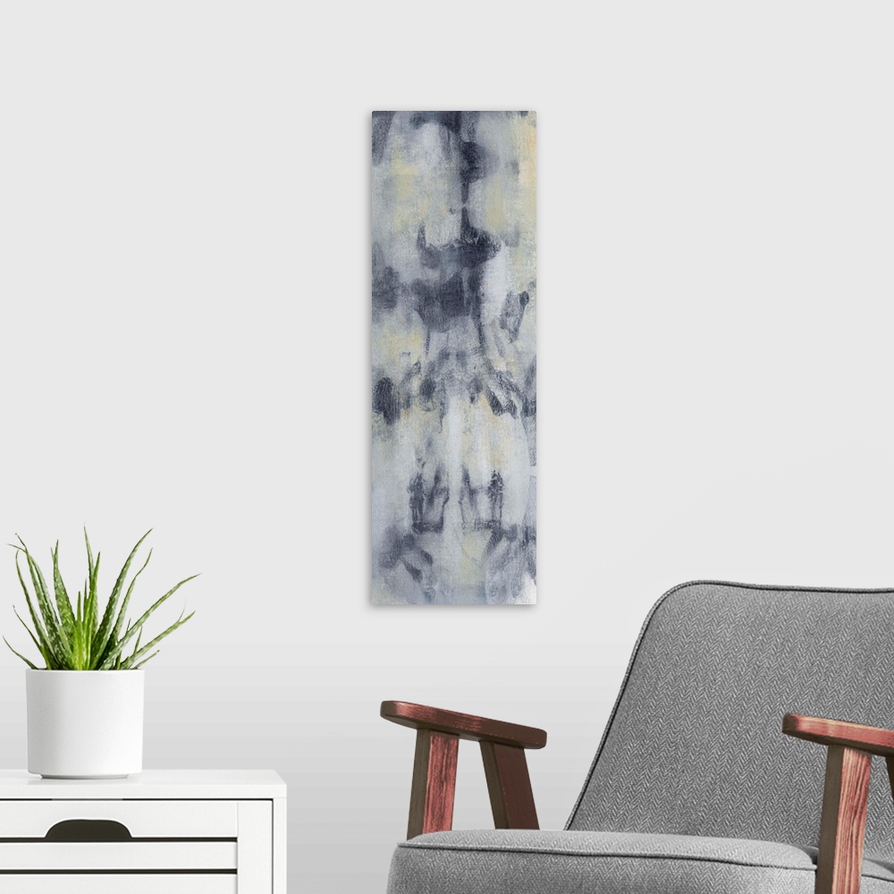 A modern room featuring Contemporary abstract painting using smokey gray and blue tones.