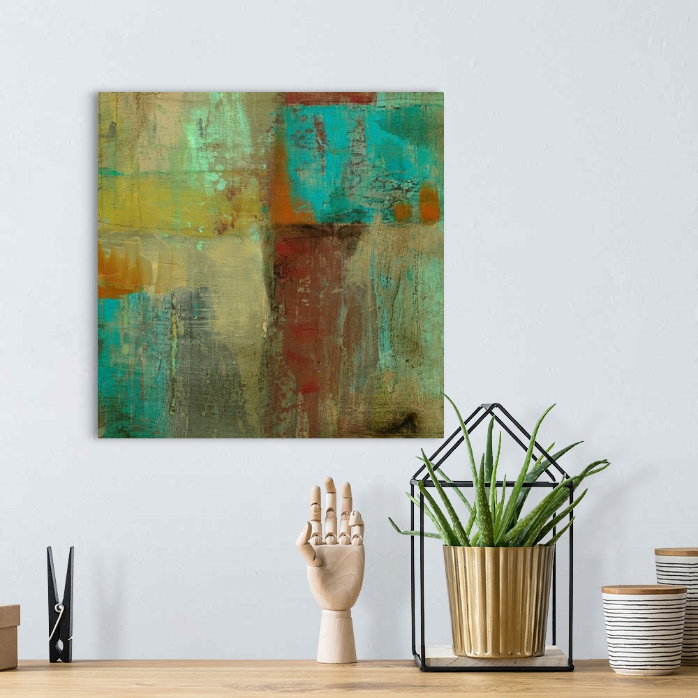 A bohemian room featuring Square abstract painting on canvas of various colors painted together.