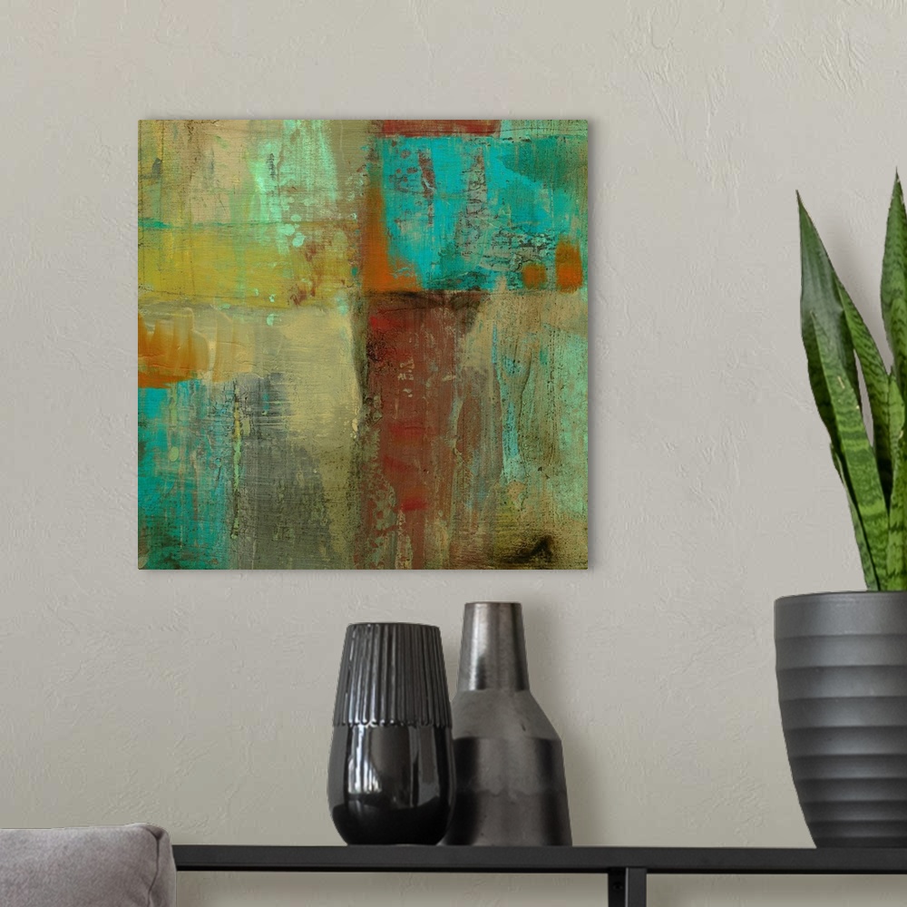 A modern room featuring Square abstract painting on canvas of various colors painted together.