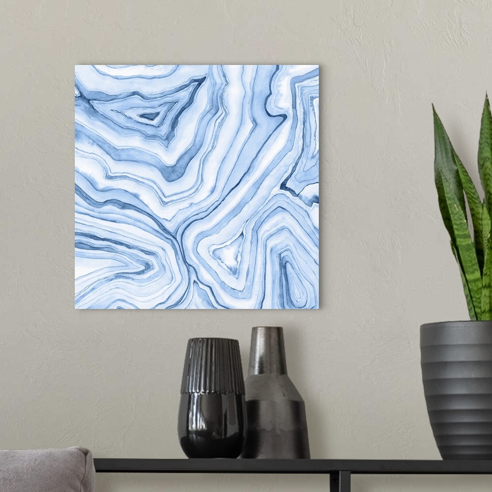 A modern room featuring Contemporary watercolor painting of light and dark blue layers of paint to resemble agate.