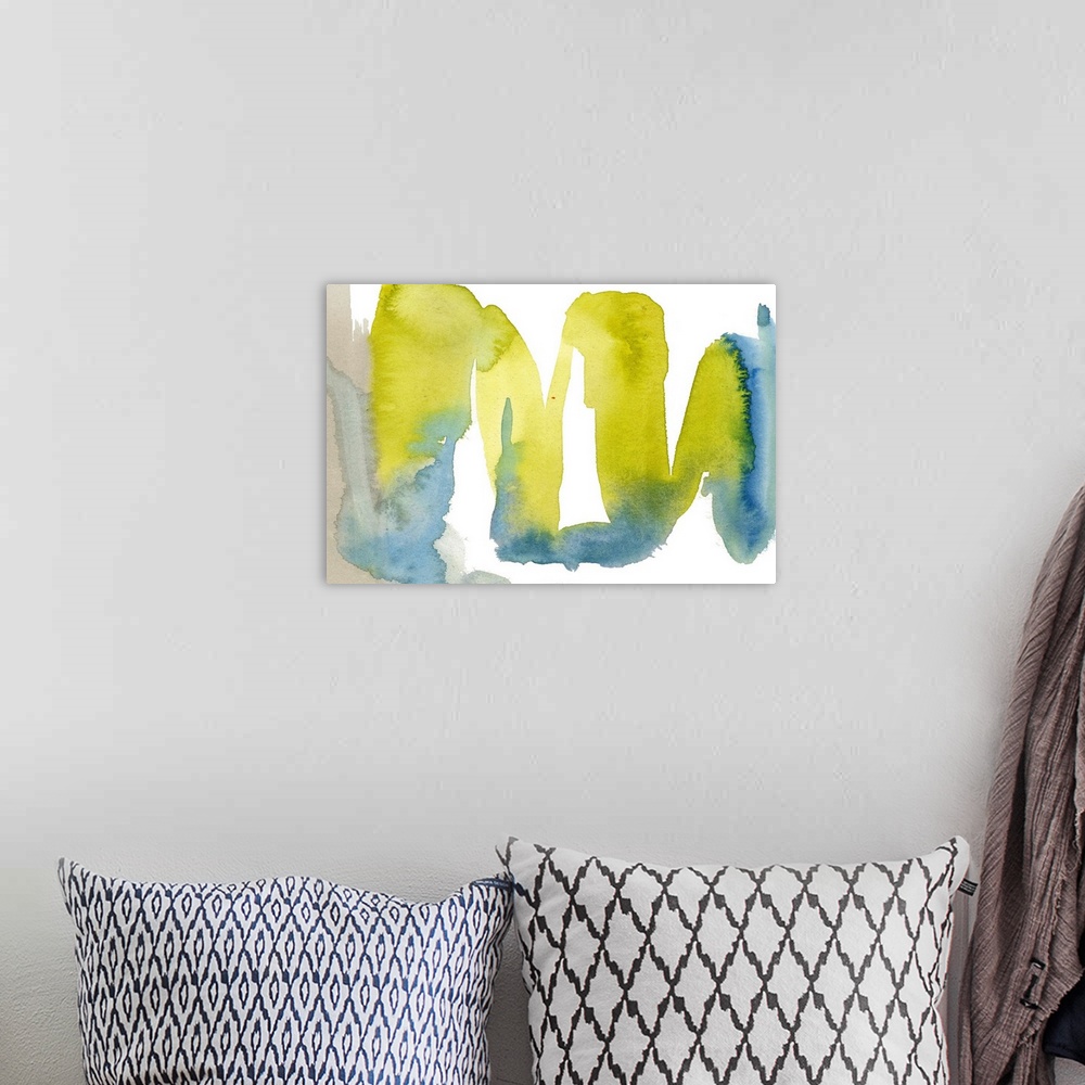 A bohemian room featuring Horizontal abstract artwork in waves of blue and yellow watercolor.