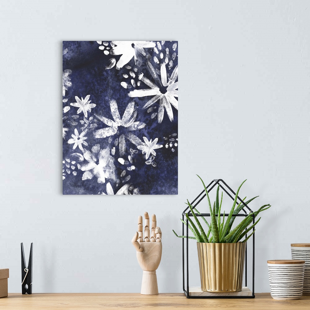 A bohemian room featuring Contemporary artwork of white silhouetted flowers against a dark blue background.