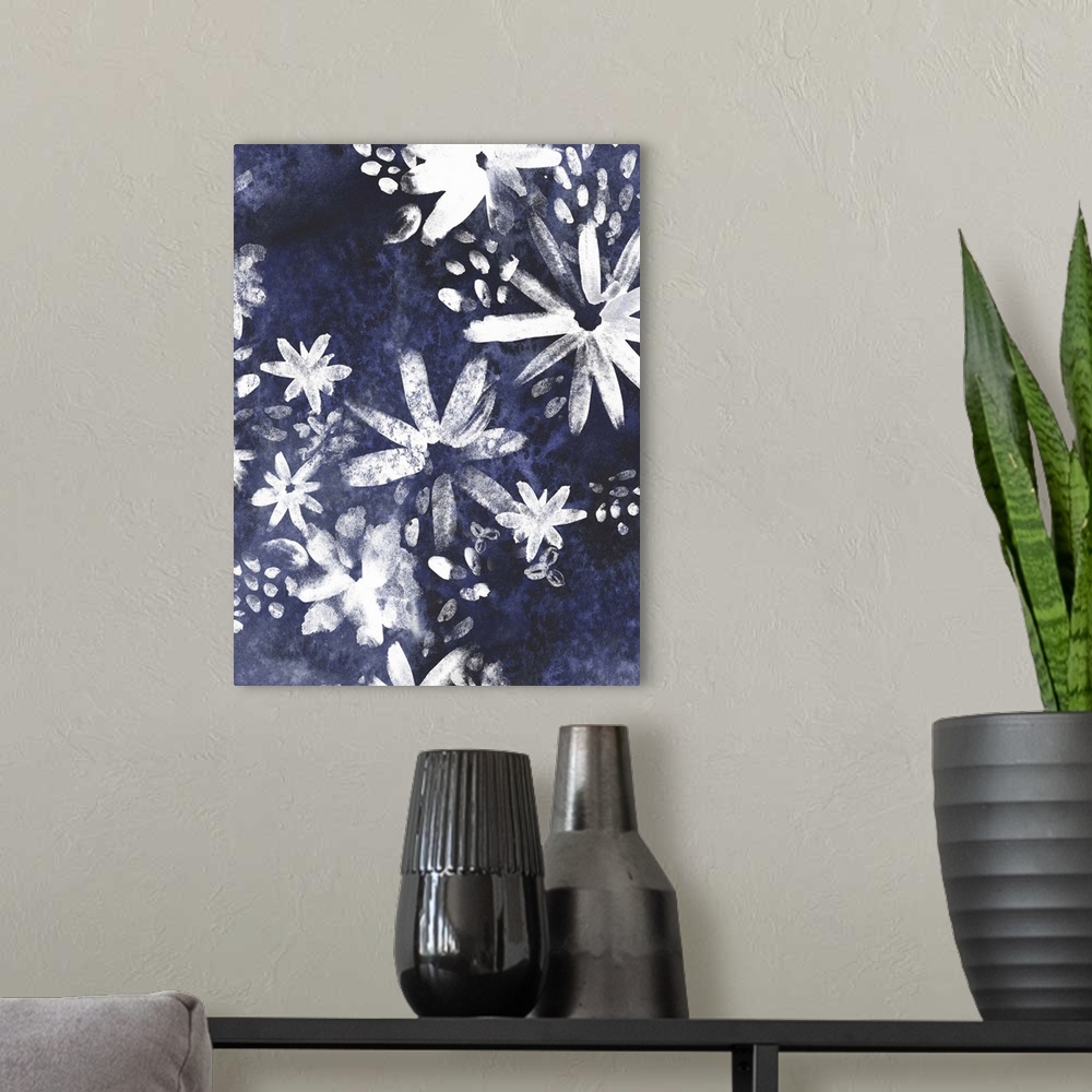 A modern room featuring Contemporary artwork of white silhouetted flowers against a dark blue background.