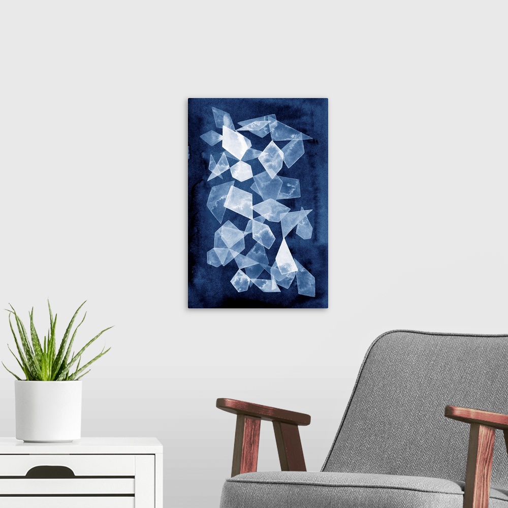 A modern room featuring This contemporary artwork features white geometric shapes that resemble falling shards of glass o...