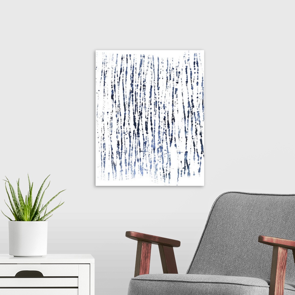 A modern room featuring Decorative abstract artwork with a design in indigo and white.