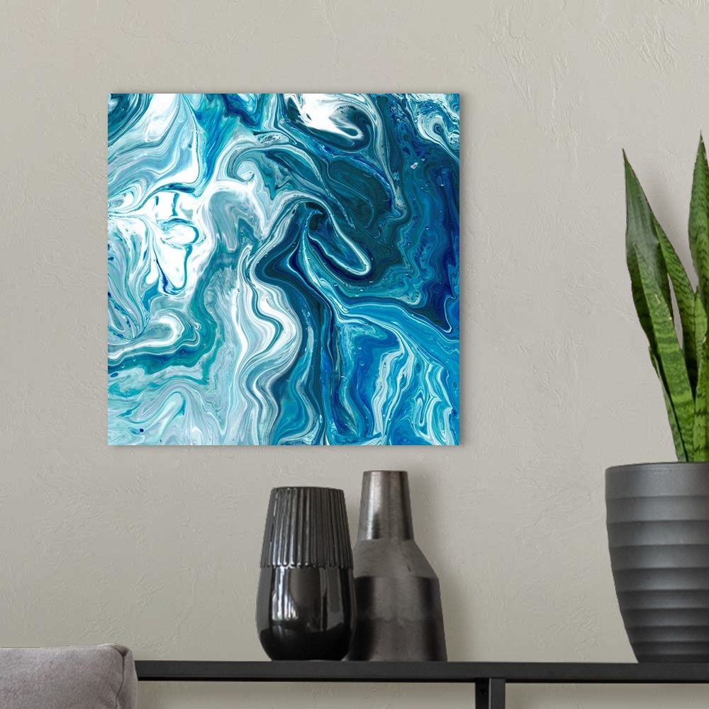 A modern room featuring Square abstract decor with marbling colors of blue and white.