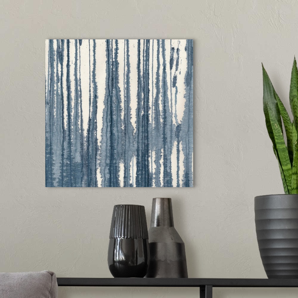 A modern room featuring A contemporary painting of blending vertical lines of indigo blue on a cream background.