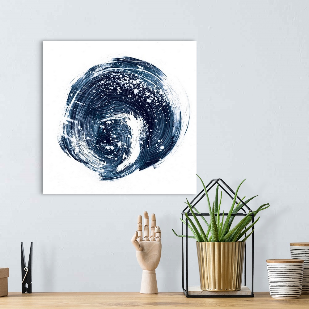 A bohemian room featuring Contemporary abstract painting of a circular nebula shape in a dark indigo blue against a white b...