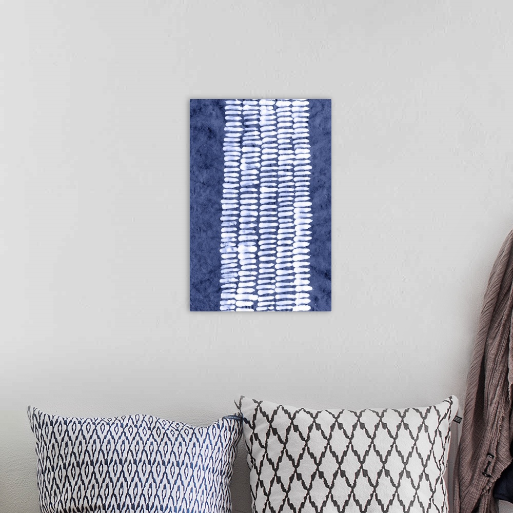 A bohemian room featuring White geometric pattern in a vertical column on a blue wash background.