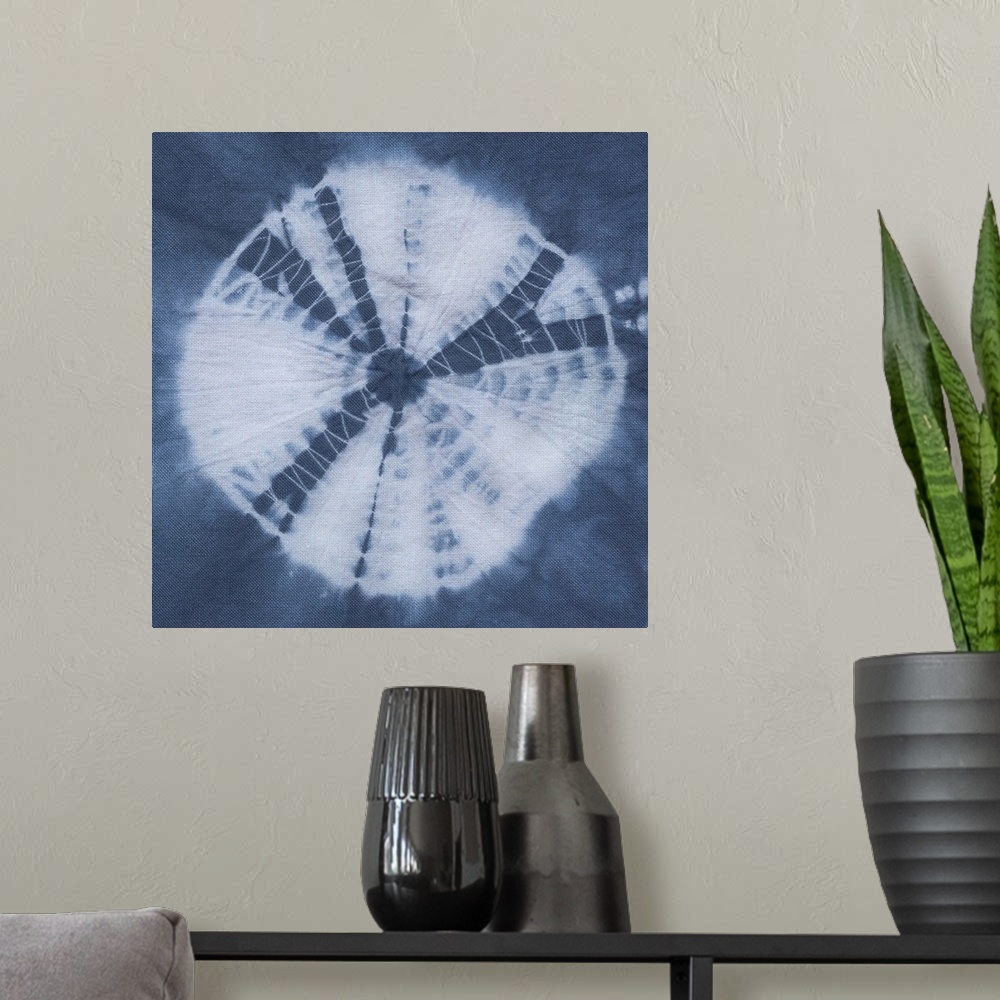 A modern room featuring Artistic design of a large tie-dye circle in white on a blue background.