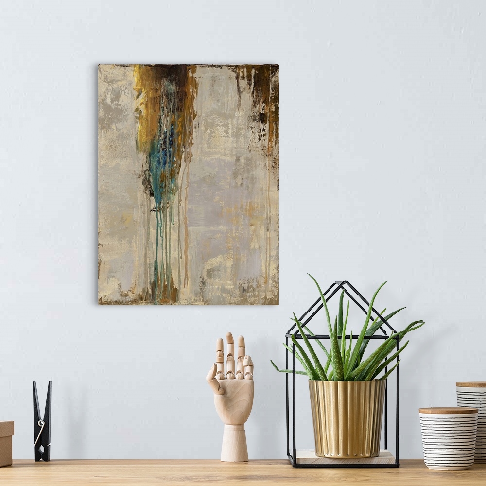 A bohemian room featuring Abstract contemporary painting with dripping brown and blue paint over a neutral background.