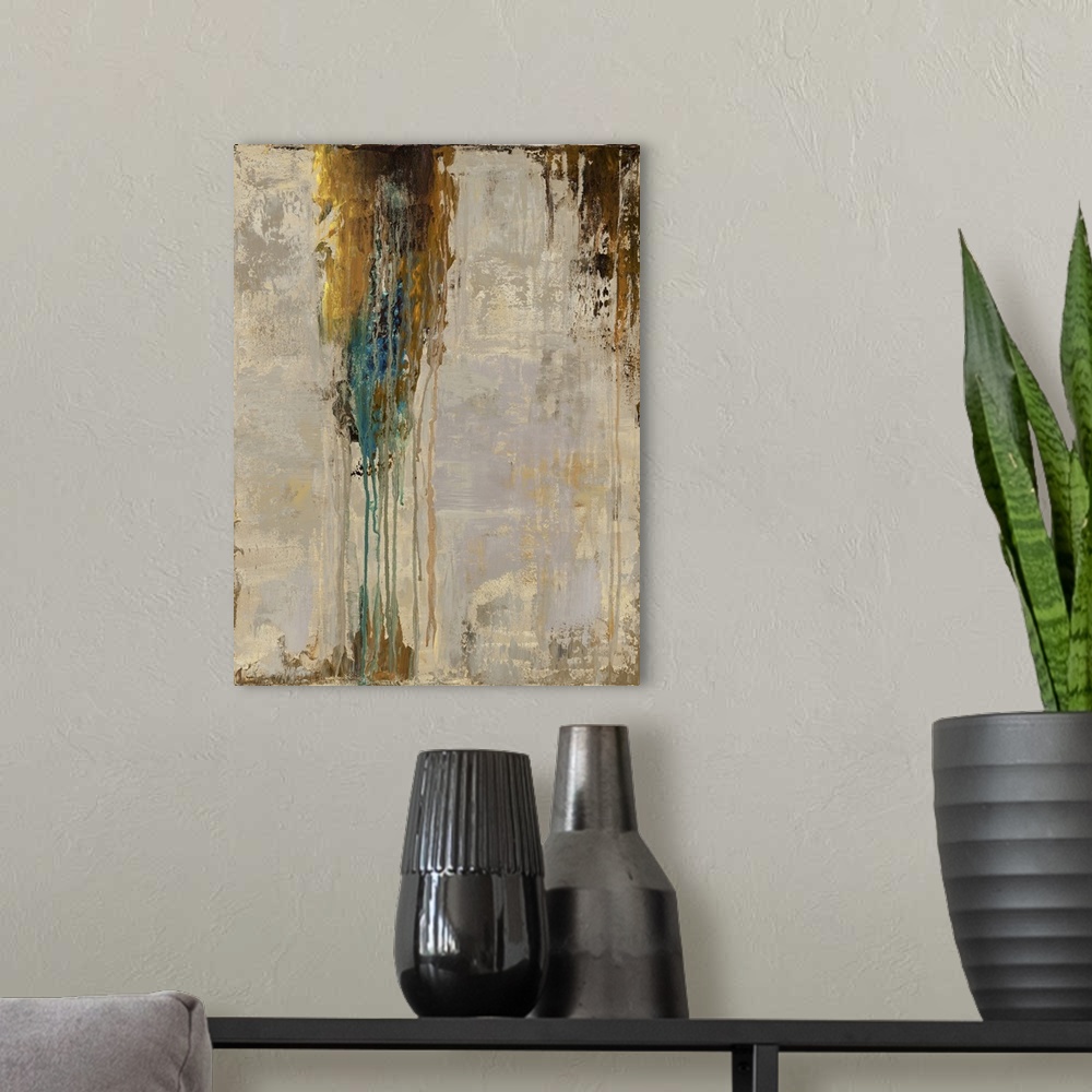 A modern room featuring Abstract contemporary painting with dripping brown and blue paint over a neutral background.