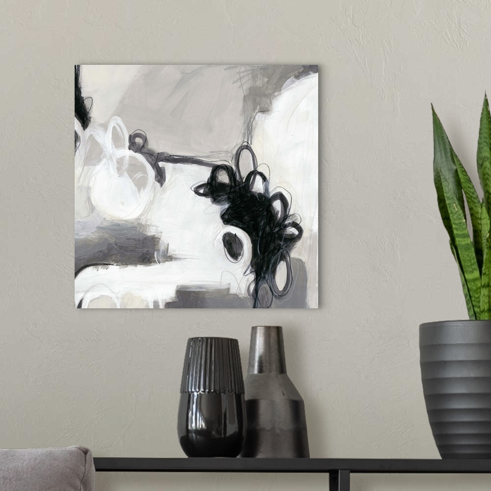 A modern room featuring Abstract painting in black and white shades.
