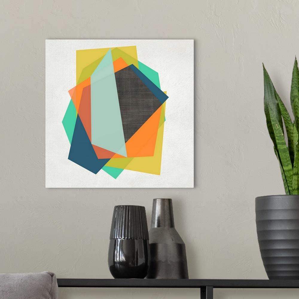 A modern room featuring Vibrant polygonal shapes layer on top of each other over a white linen background with a dark gra...