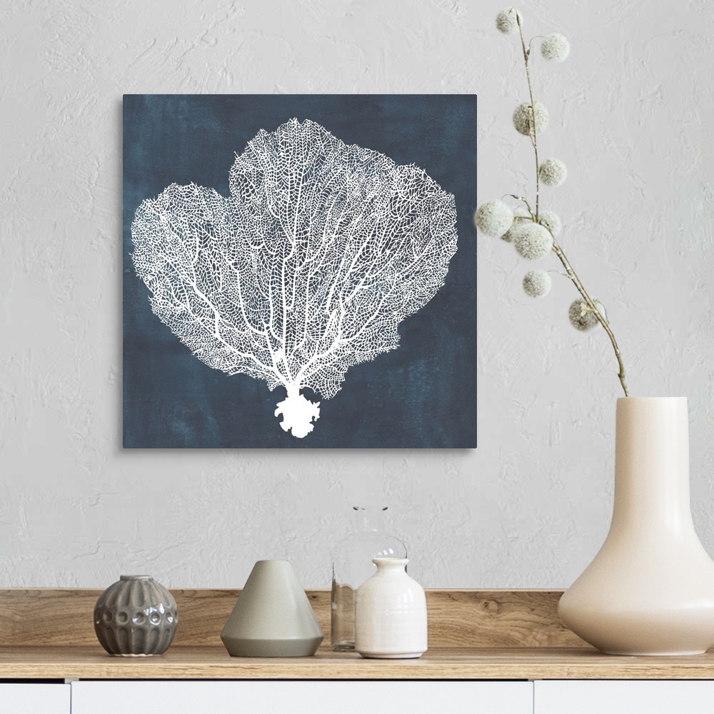 A farmhouse room featuring Contemporary nautical themed artwork of a sea fan in white against a dark navy blue background.