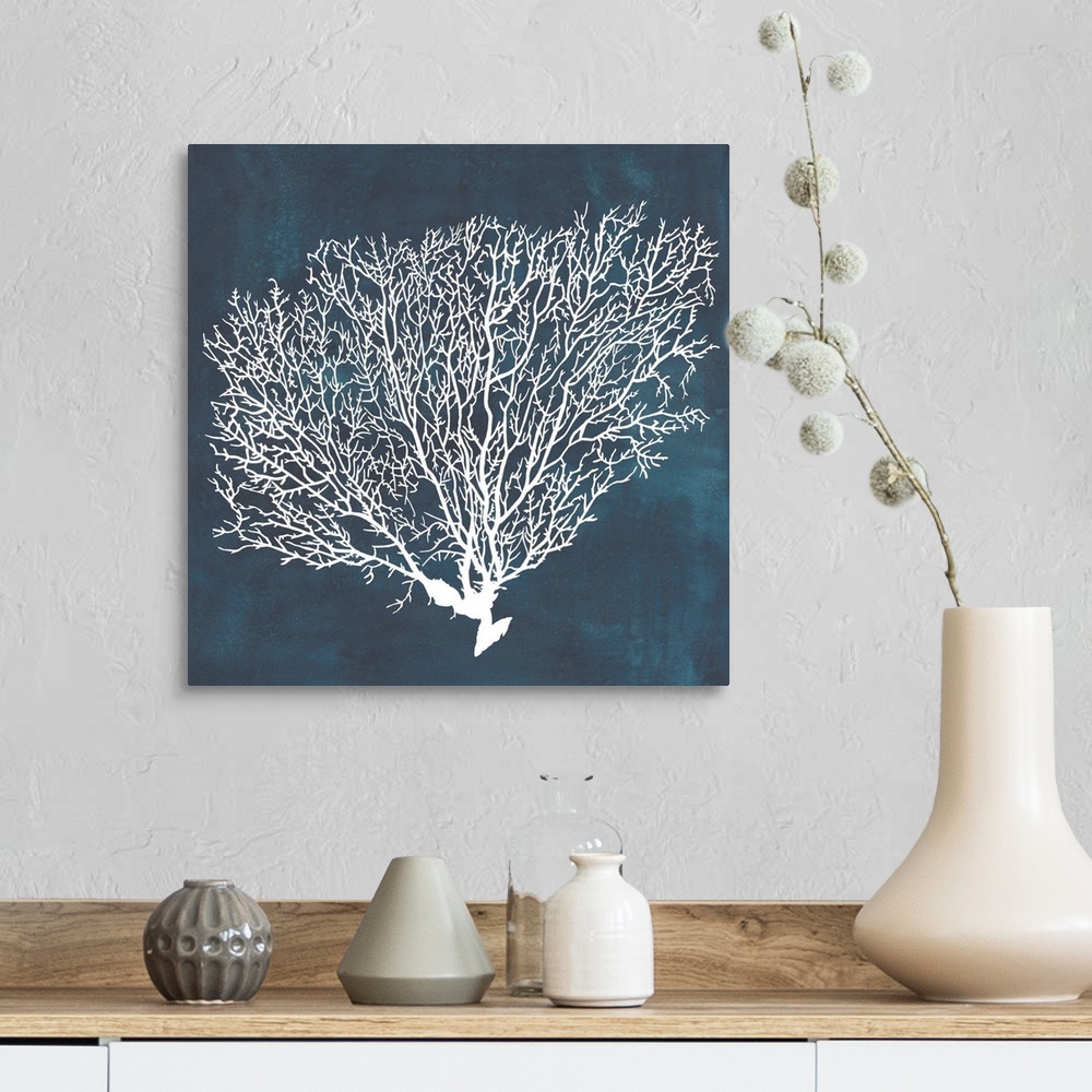 A farmhouse room featuring Contemporary nautical themed artwork of a sea fan in white against a dark navy blue background.