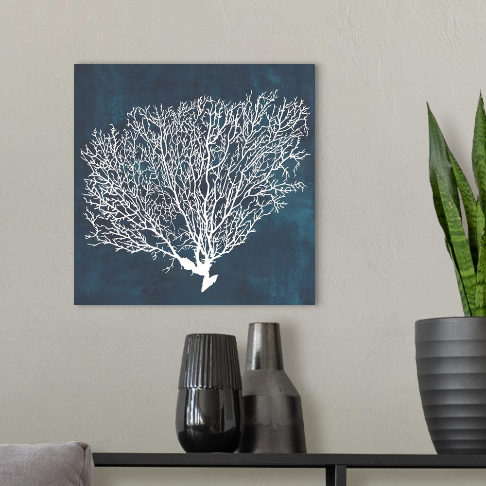 A modern room featuring Contemporary nautical themed artwork of a sea fan in white against a dark navy blue background.