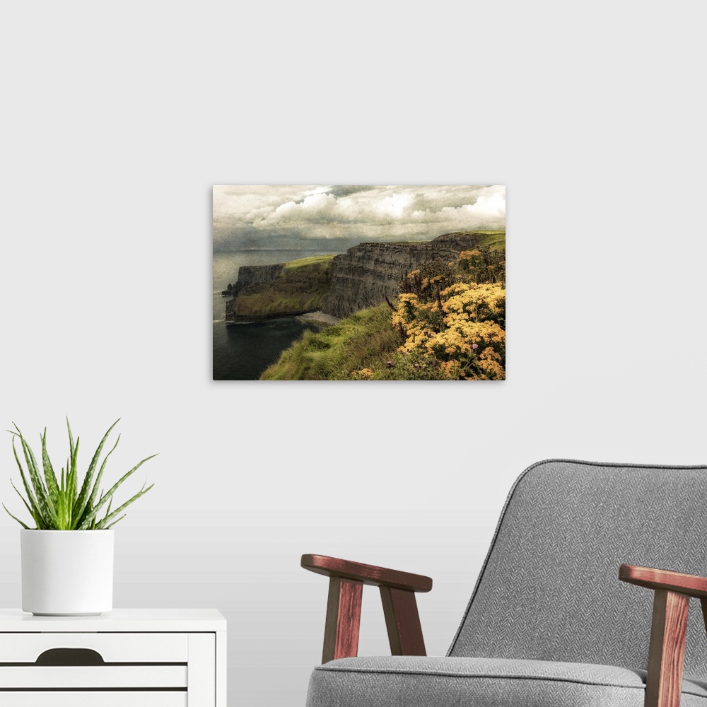 A modern room featuring Fine art photo of cliffs on the Irish coast under a cloudy sky.