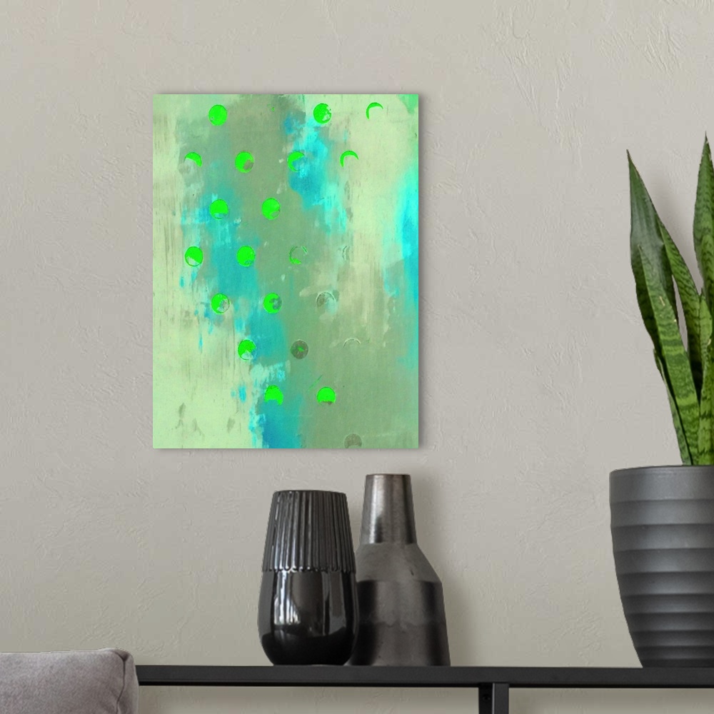 A modern room featuring A vertical abstract painting of shades of blue and green with neon green circles overlapping.