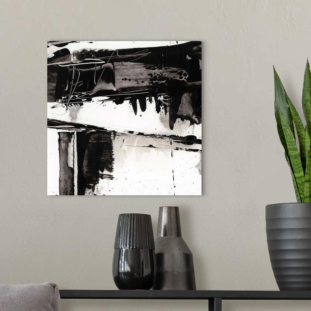 A modern room featuring Abstract painting of chaotic wide black  brush strokes with overlaying splatters of black.