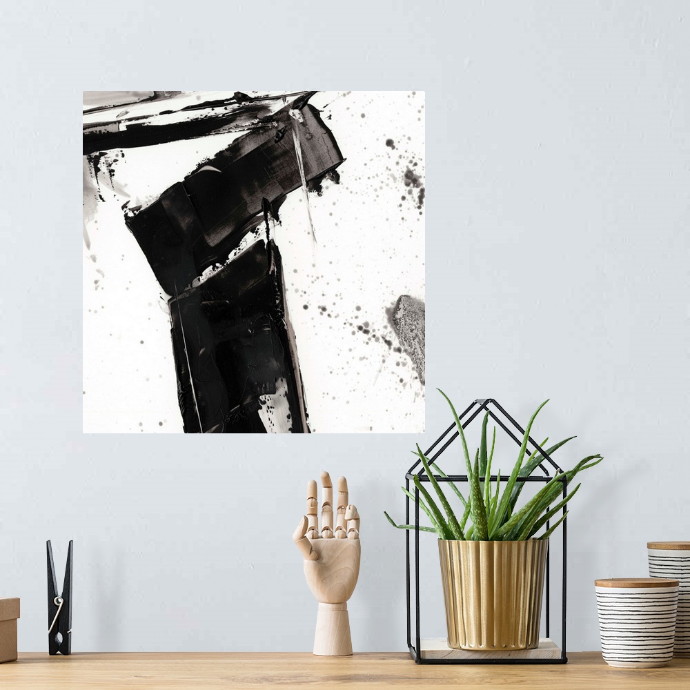 A bohemian room featuring Abstract painting of chaotic wide black  brush strokes with overlaying splatters of black.