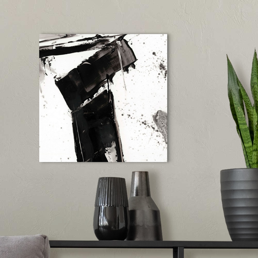 A modern room featuring Abstract painting of chaotic wide black  brush strokes with overlaying splatters of black.