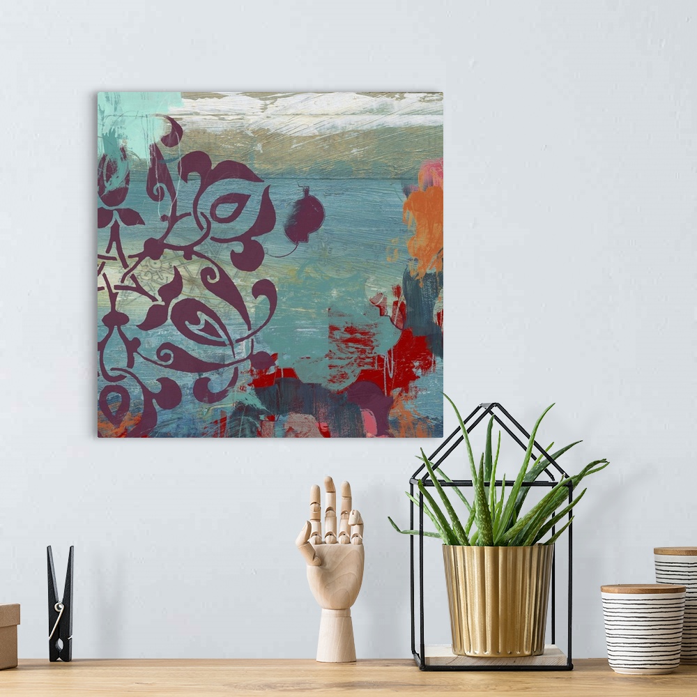 A bohemian room featuring Abstract painting using teal, aqua and green colors with red fragmented patterns.