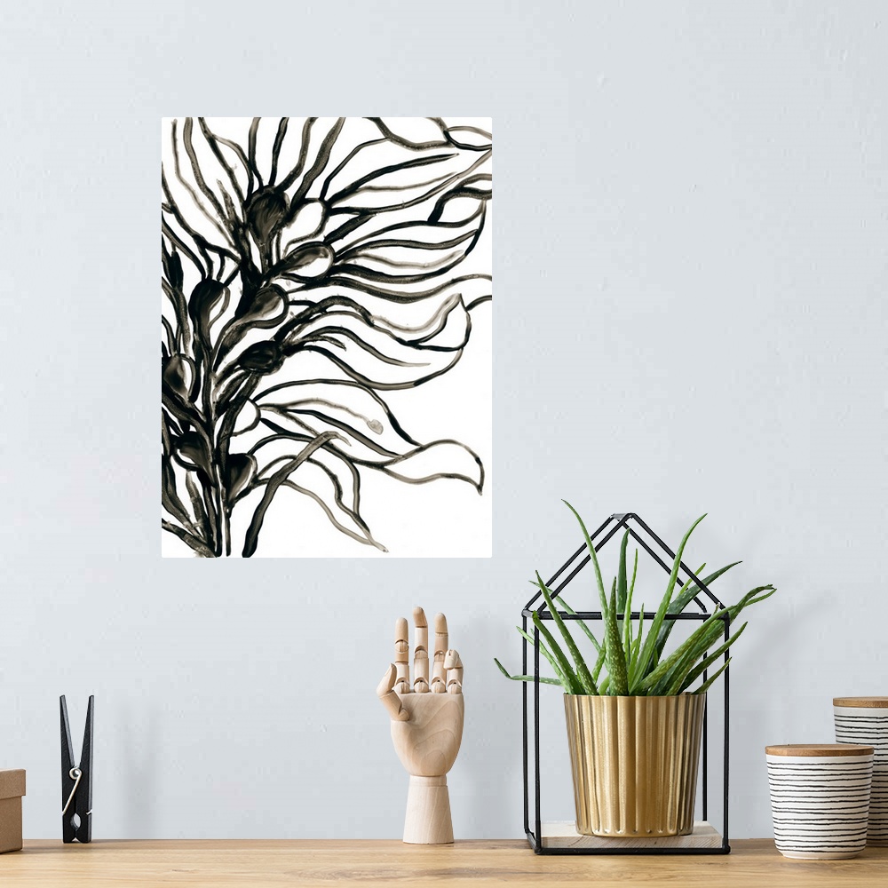 A bohemian room featuring A simple, minimalist black and white painting of wavy leaves on a stalk