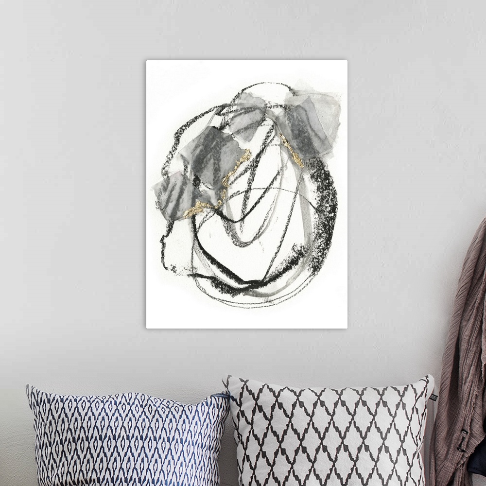 A bohemian room featuring Abstract painting of black scribbles and gray patches with gold leaf accents on a white background.